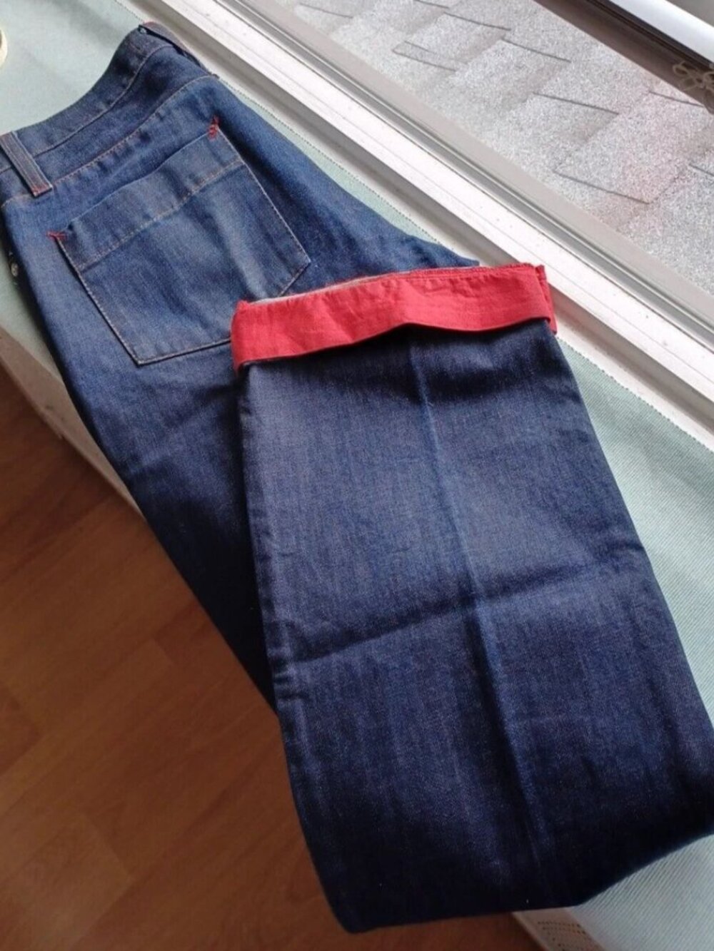 DKNY, 32'' WAIST AND 34'' INSEAM, BLUE WITH THE RED BOTTOM DETAILS.